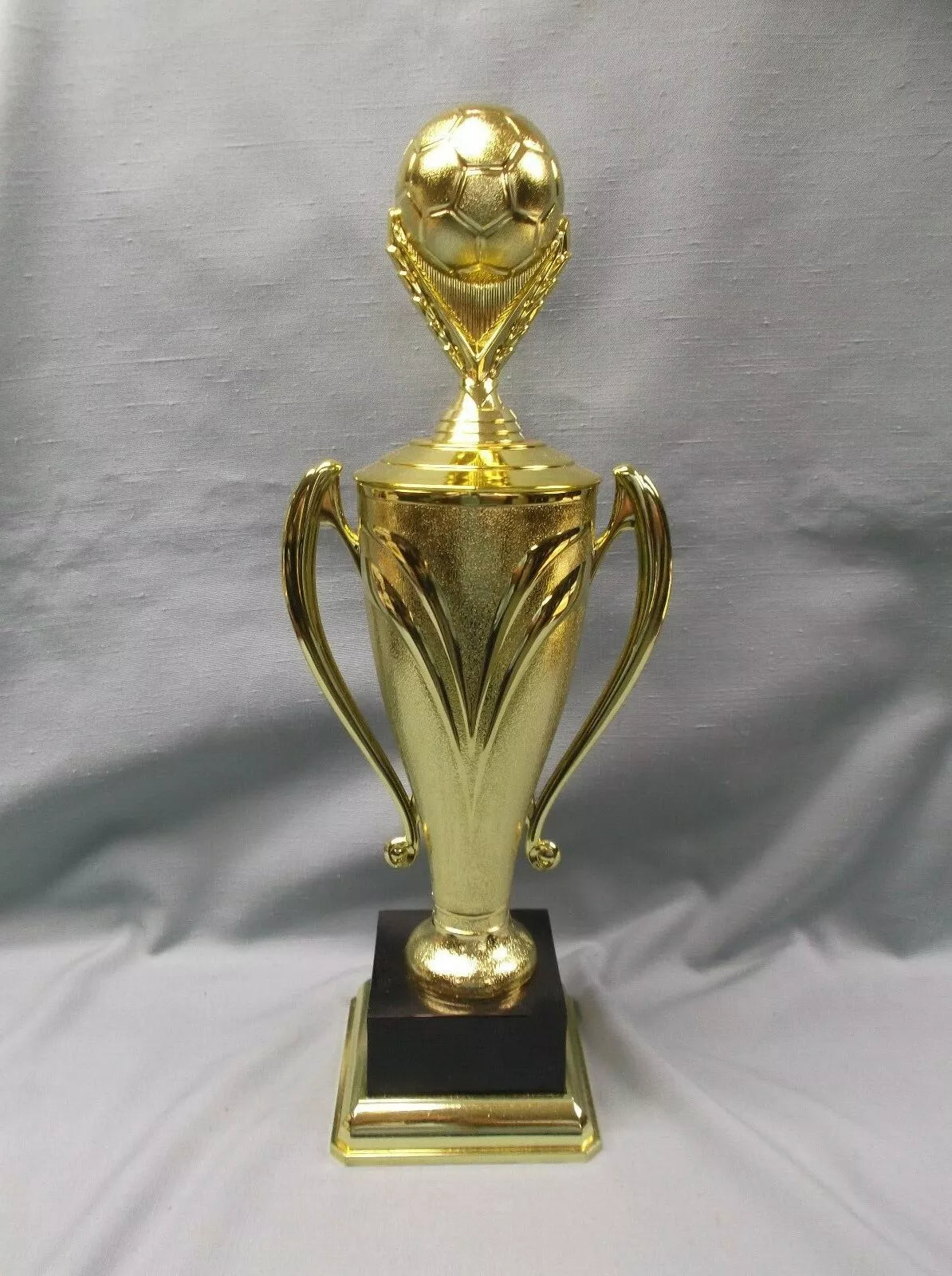 gold cup soccer ball topper with large decorative block black base 17" size